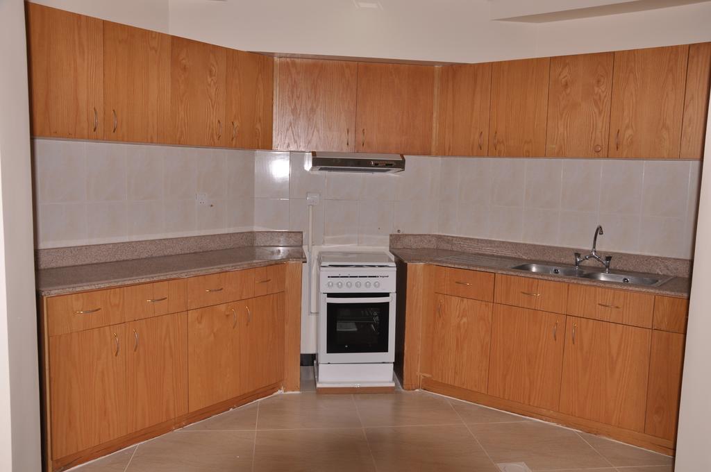 Al Hamra Plaza Apartman Manáma Szoba fotó