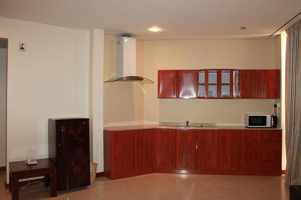 Al Hamra Plaza Apartman Manáma Szoba fotó