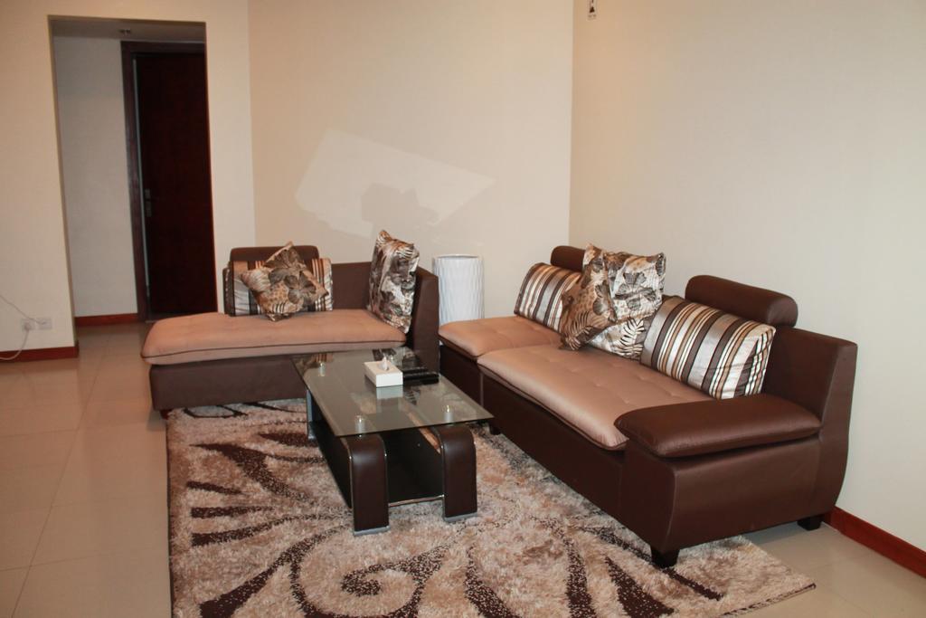 Al Hamra Plaza Apartman Manáma Szoba fotó
