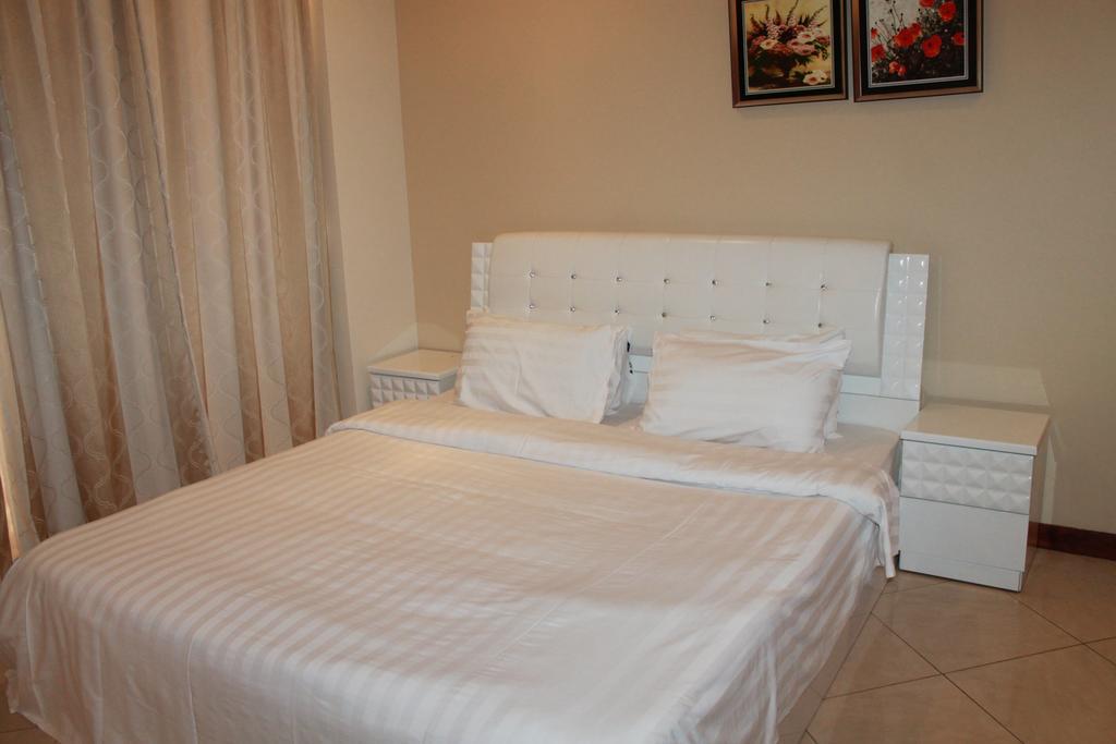 Al Hamra Plaza Apartman Manáma Szoba fotó