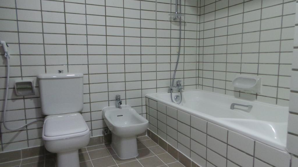 Al Hamra Plaza Apartman Manáma Szoba fotó