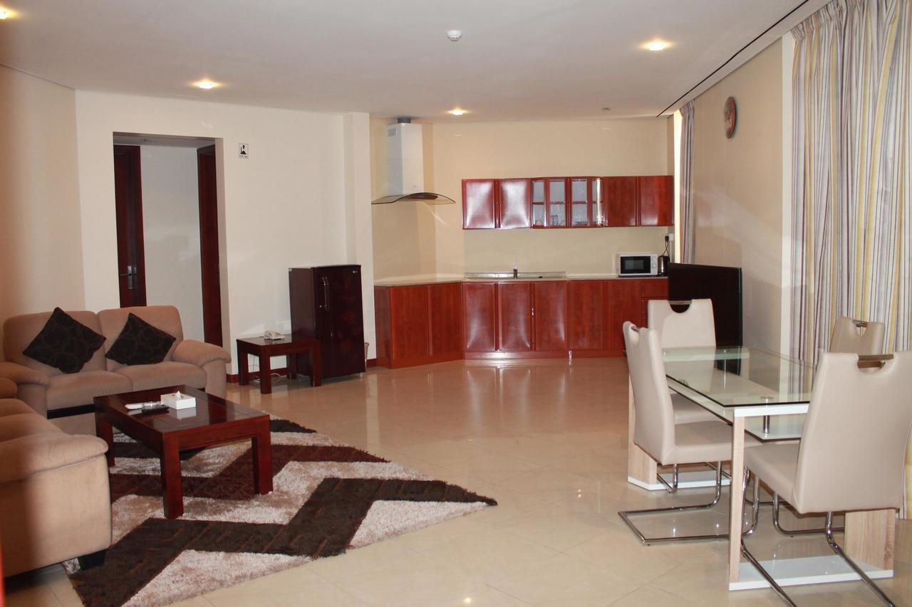 Al Hamra Plaza Apartman Manáma Szoba fotó