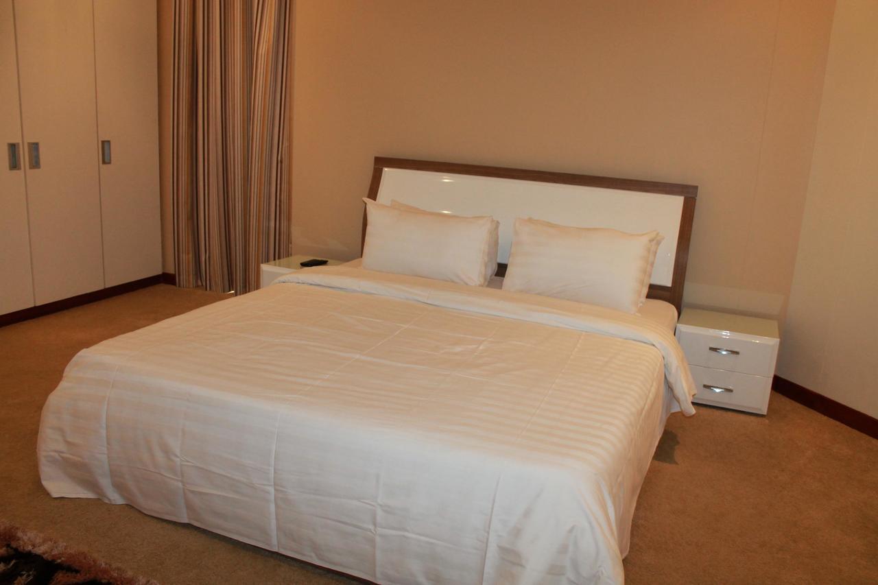 Al Hamra Plaza Apartman Manáma Szoba fotó